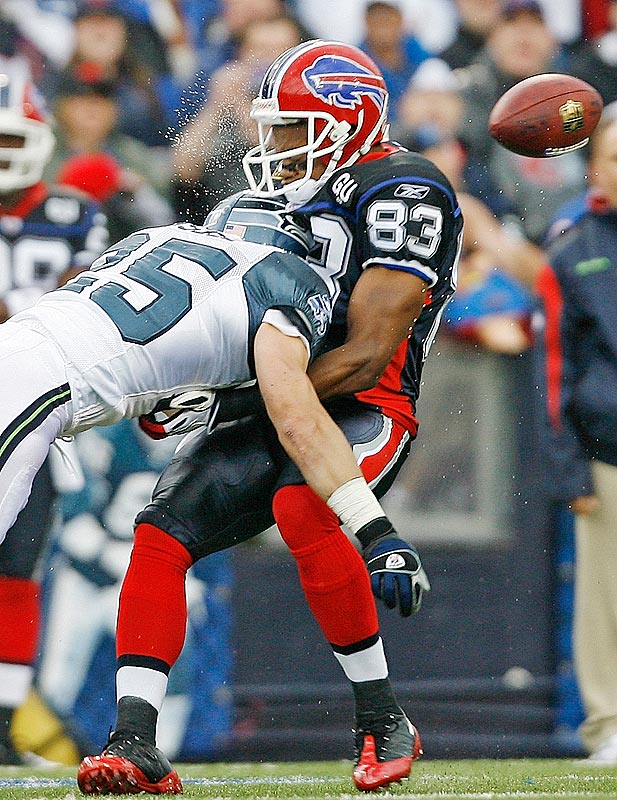 Seahawks safety Brian Russell drills Buffalo Bills wide receiver Lee Evans, causing an incomplete pass. (Photorapher: Dan DeLong)