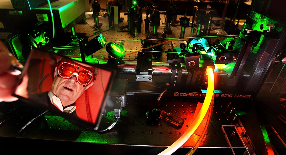 Dr. John Cramer, a physicist at the University of Washington, is experimenting with using lasers to see if time can go backwards. Cramer, widely recognized for his interpretation of quantum theory, also writes science fiction books. (Photographer: Scott Eklund)